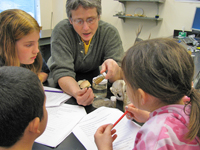 Scientist Kate Wynne helps students study what whales eat.