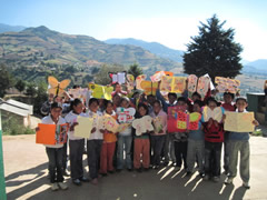 Children receiving symbolic monarch butterflifes in Mexico.