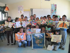 Children receiving symbolic monarch butterflifes in Mexico.