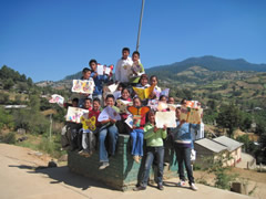 Children receiving symbolic monarch butterflifes in Mexico.
