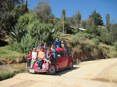 Children receiving symbolic monarch butterflifes in Mexico.