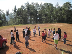Children receiving symbolic monarch butterflies in Mexico.