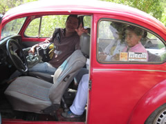 Children receiving symbolic monarch butterflies in Mexico.