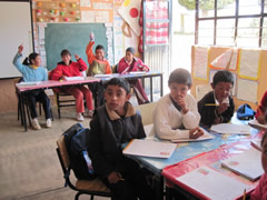 Children receiving symbolic monarch butterflies in Mexico.