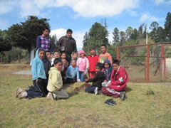 Children receiving symbolic monarch butterflies in Mexico.