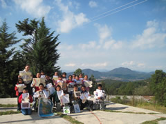 Children receiving symbolic monarch butterflies in Mexico.