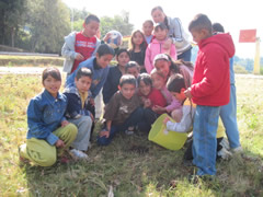 Children receiving symbolic monarch butterflies in Mexico.
