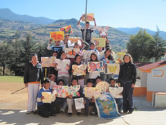 Children receiving symbolic monarch butterflifes in Mexico.