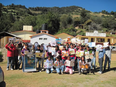 Children receiving symbolic monarch butterflifes in Mexico.