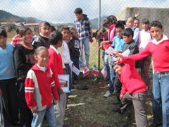 Children receiving symbolic monarch butterflifes in Mexico.