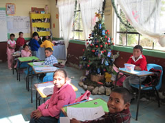 Children receiving symbolic monarch butterflifes in Mexico.