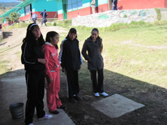Children receiving symbolic monarch butterflies in Mexico.