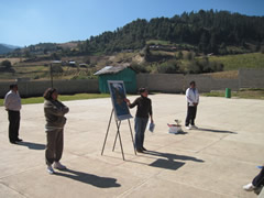 Children receiving symbolic monarch butterflies in Mexico.