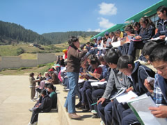 Children receiving symbolic monarch butterflies in Mexico.