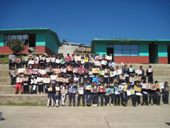 Children receiving symbolic monarch butterflies in Mexico.