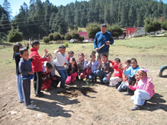 Students receiving symbolic monarch butterflies.
