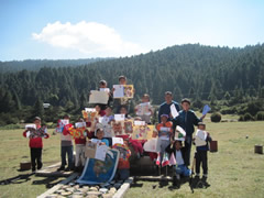 Students receiving symbolic monarch butterflies.