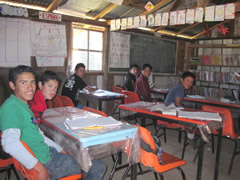 Children receiving symbolic monarch butterflies in Mexico.