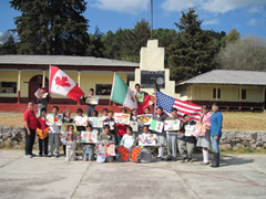 children receiving symbolic butterflies in Mexico