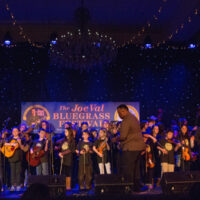 Soundman Al Garvin sets up the stage for Kids Academy at Joe Val (2/19/17) - photo © Tara Linhardt
