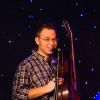Tony Watt introduces the Kids Academy advanced band at Joe Val (2/19/17) - photo © Tara Linhardt