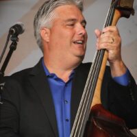 Micky Harris with Rhonda Vincent & The Rage at the Gettysburg Bluegrass Festival (May 2017) - photo by Frank Baker