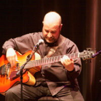 Joel Landsberg with The Kruger Brothers at The Rose State College Hudiburg Center - photo by Pamm Tucker