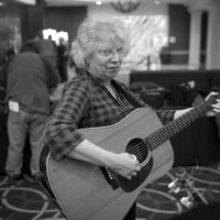 Checking out guitars at the 2018 DC Bluegrass Festival - photo by Jeromie Stephens