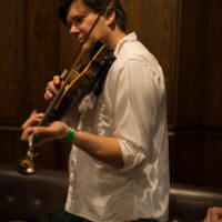 Wally Hughes in a hallway jam at the 2018 DC Bluegrass Festival - photo by Jeromie Stephens