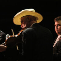 Michael Feagan with Larry Sparks at the 2018 Doyle Lawson & Quicksilver Bluegrass Festival - photo by Laura Tate Photography