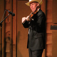 Michael Feagan with Larry Sparks at the 2018 Doyle Lawson & Quicksilver Bluegrass Festival - photo by Laura Tate Photography