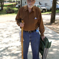 Bobby Franklin heading for the stage at the 2018 Doyle Lawson & Quicksilver Bluegrass Festival - photo by Laura Tate Photography