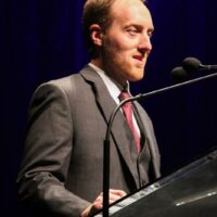 Justin Moses accepts Dobro Player of the Year at the 2018 International Bluegrass Music Awards - photo © Frank Baker
