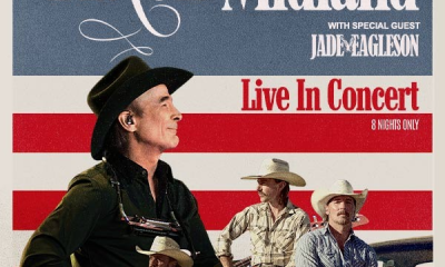 Tour poster showing Clint Black in a cowboy hat and the three members of Midland in front of red, white and blue stripes