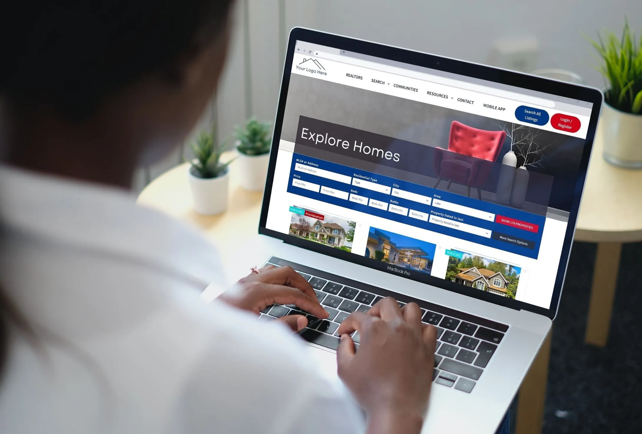 lead-city-website-on-laptop-with-woman-typing