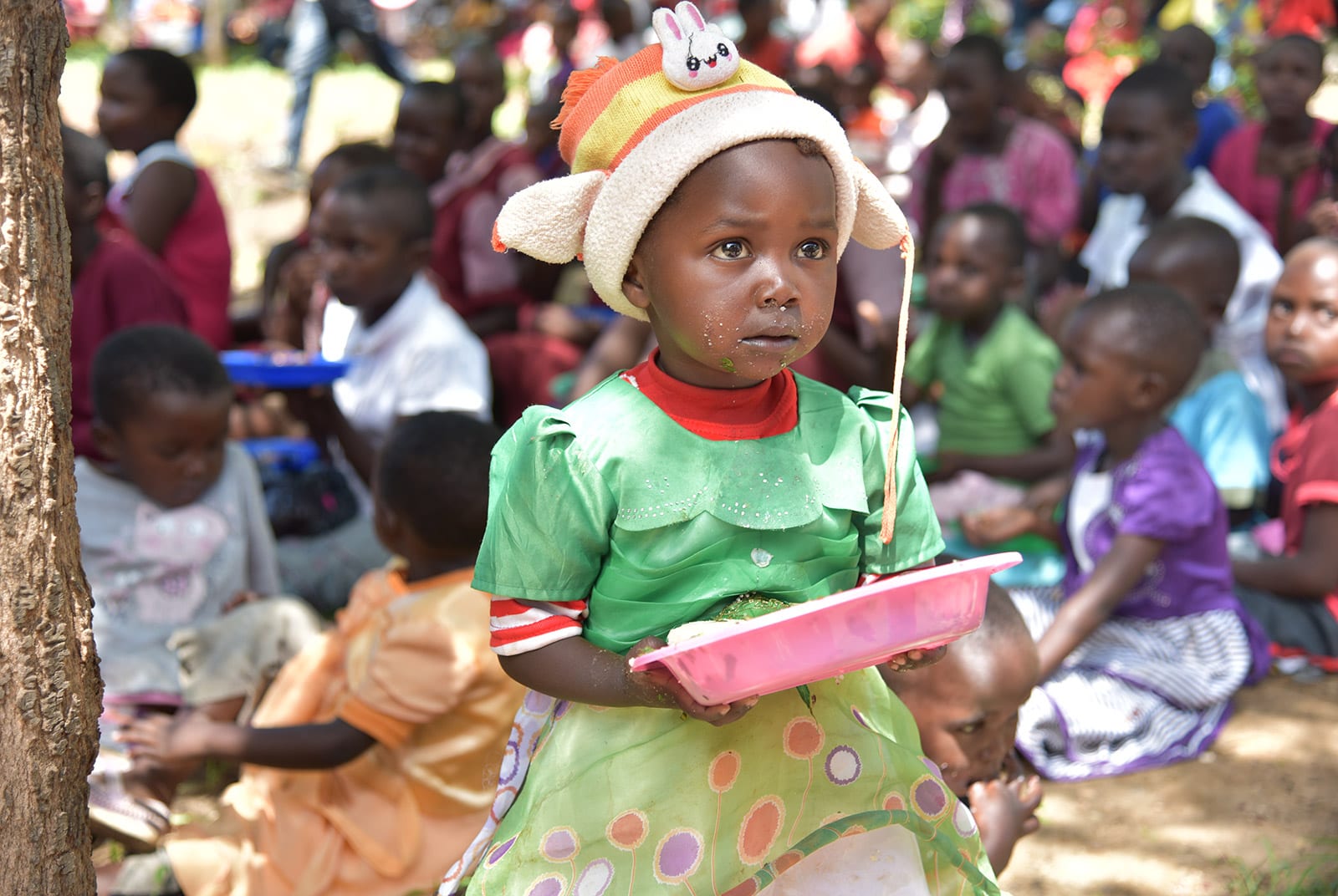 Mully child with plate of food