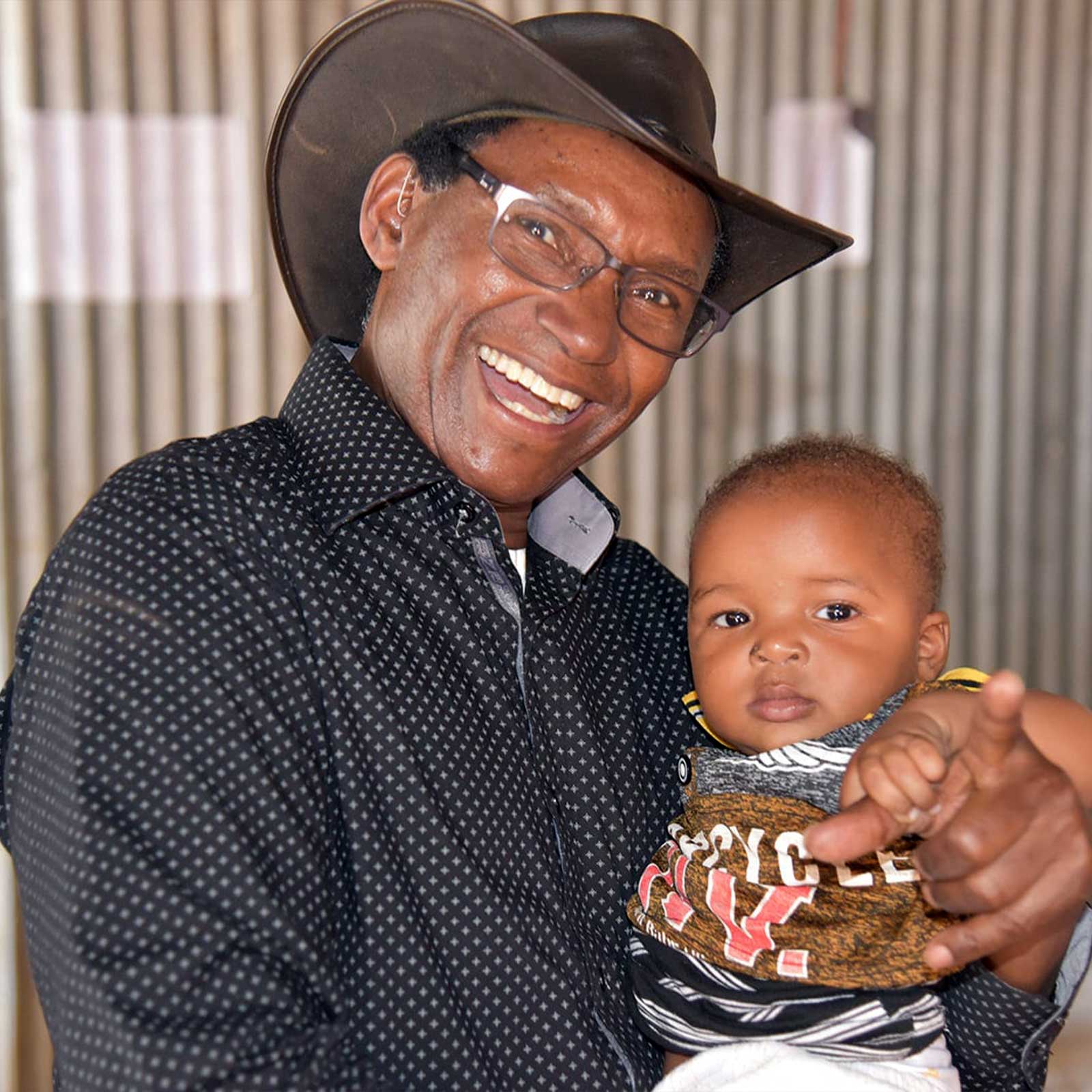 Charles Mulli with toddler