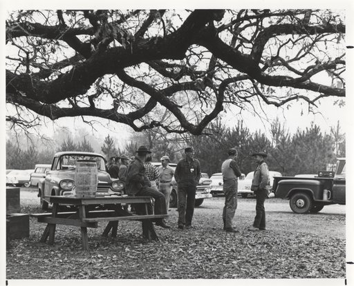 Historic photo - hunters in yard of Lodge