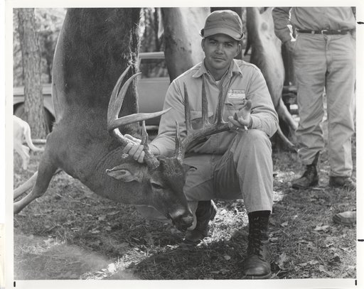 Historic - hunter with deer taken during hunt at Westervelt Lodge