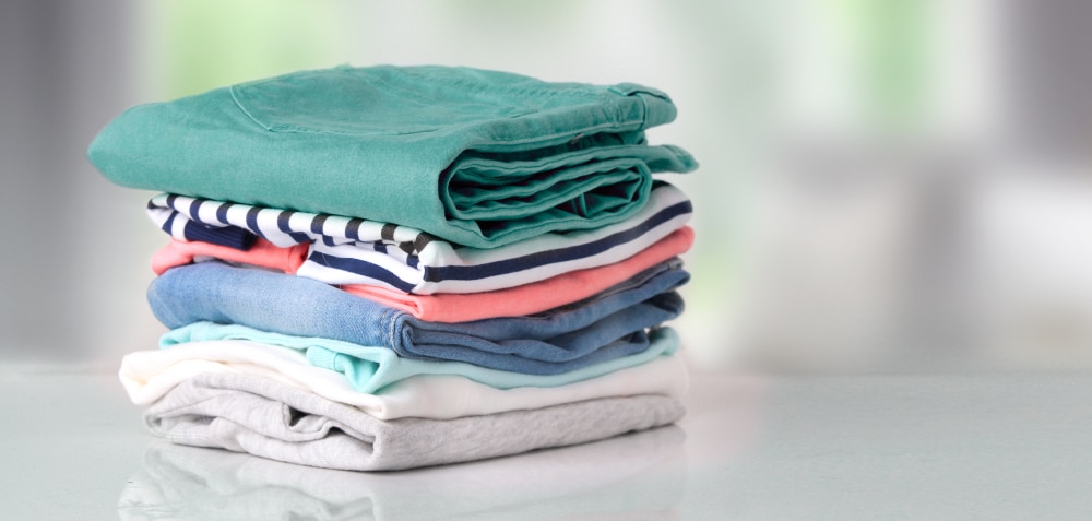 stack of clothes on a white counter