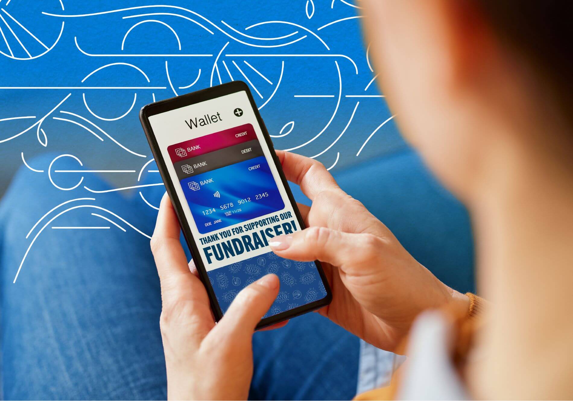 Digital Wallets, Contactless Giving, & Other Payment Trends in Fundraising - person holding their phone displaying a digital wallet with the message "Thank You for Supporting Our Fundraiser!"