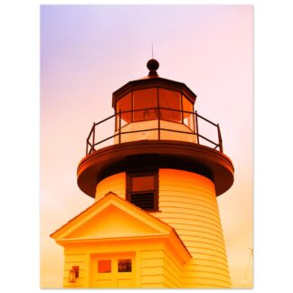 A sunlit lighthouse print with warm tones from the sunset, creating a serene and cozy atmosphere.