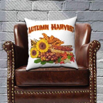 Pillow with "Autumn Harvest" text, featuring sunflowers, corn, nuts, and colorful leaves. Vibrant, warm tones evoke a festive fall mood.