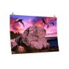 Framed seascape photo above orange sofa. Features a large rock, vibrant pink and purple sunset, and silhouetted birds in flight, conveying tranquility.