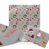 Festive Christmas wrapping paper with Santa, wreaths, bells, and red text saying "Ho Ho Ho Merry Christmas" on a gray background. A wrapped gift is included.