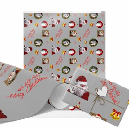 Festive Christmas wrapping paper with Santa, wreaths, bells, and red text saying "Ho Ho Ho Merry Christmas" on a gray background. A wrapped gift is included.