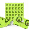 Bright green Christmas wrapping paper featuring festive wreaths and candy canes. The paper is partially wrapped around a gift with a heart-shaped tag.