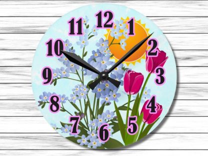 Round clock with pink numbers against a floral background of blue forget-me-nots and pink tulips, set under a bright sun. Warm, cheerful tone.