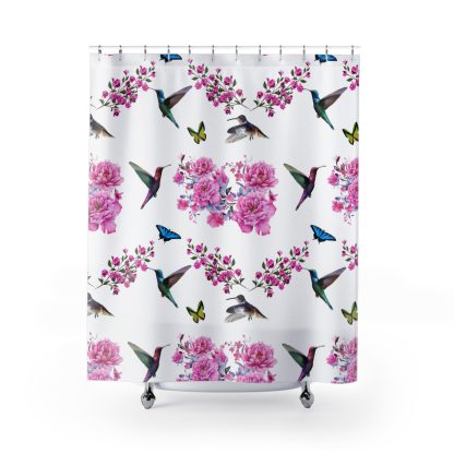 Shower curtain with a vibrant pattern of pink peonies, magenta floral branches, hummingbirds, and colorful butterflies on a white background.