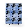 Shower curtain with black tree silhouettes and scattered maple leaves on a textured blue background. The design creates a serene, natural atmosphere.